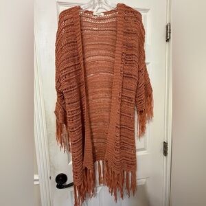 Pretty Crochet sweater / shawl in a cantalope color.  Size medium/large
